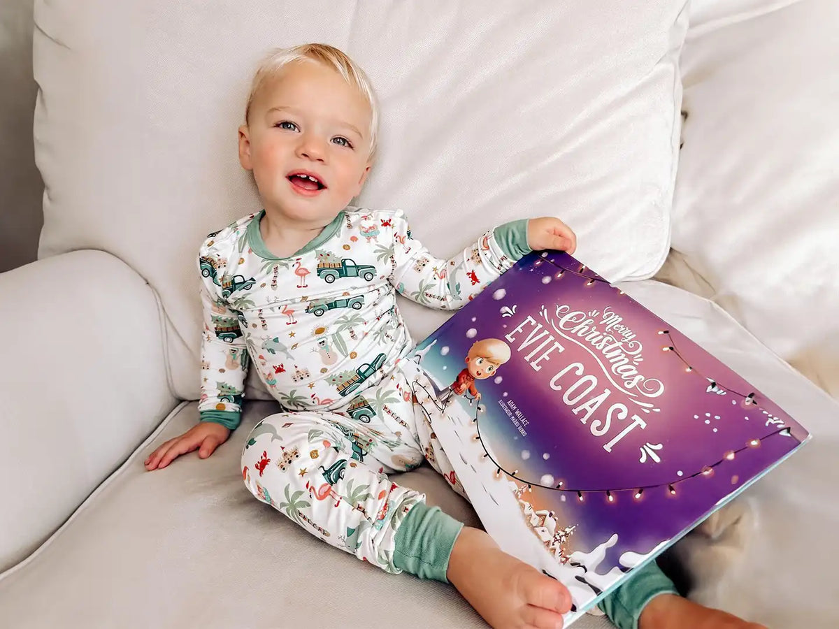 Little Evie is enjoying her personalized Christmas book which is perfect gift for the holidays.