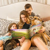 A family reading a custom storybook featuring a playful dog and two kids – personalized book for dog and kids.